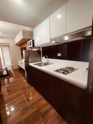 1BR with Balcony and WiFi at Air Residences Makati