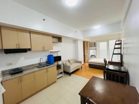 Furnished Studio with Balcony in Paseo De Roces Condominiums